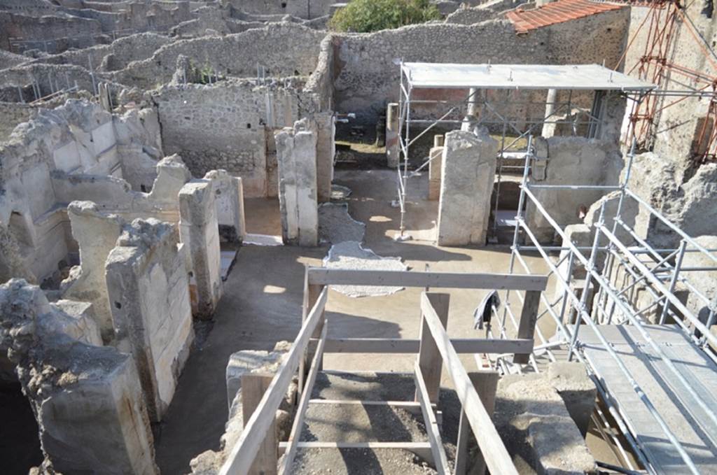 V.2.Pompeii. Casa di Orione. August 2018. 
Looking west across atrium towards doorways to rooms A8, A7 the tablinum, and A6 on the west side of the atrium A12.
Photograph © Giuseppe Scarica, Ecampania.it.
This room was possibly used as a day-room/salon or oecus. 
Originally it may have been used as a dining-room opening onto the garden portico, as seen by a blocked doorway in the west wall, opposite the entrance doorway, blocked and re-used as a cupboard.

