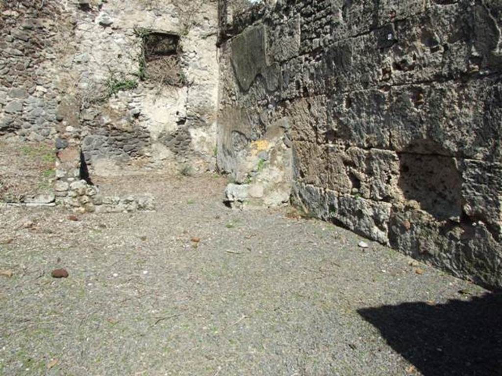 V.3.2 Pompeii. March 2009. Looking north along the east side of workshop, to the rear room with window.

