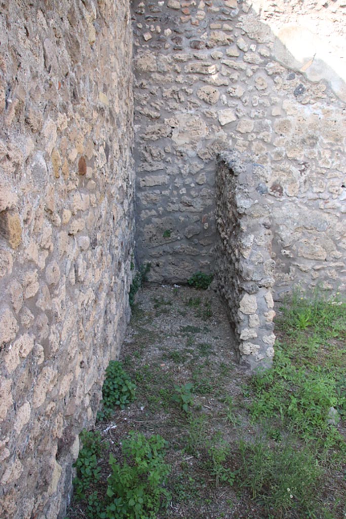 V.3.3 Pompeii. October 2023. 
Looking north in latrine in north-west corner of rear room. Photo courtesy of Klaus Heese.
