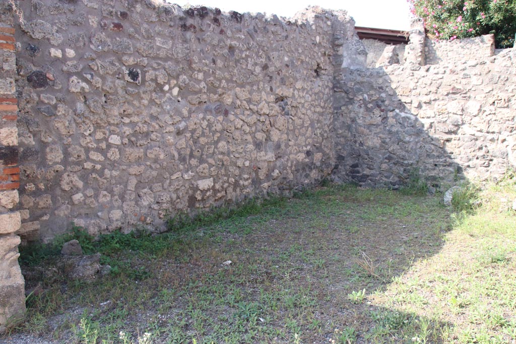 V.3.5 Pompeii. October 2023. Looking north along west wall of shop-room. Photo courtesy of Klaus Heese.