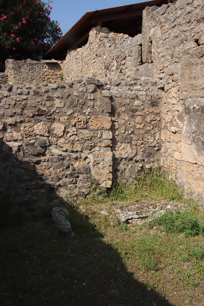 V.3.5 Pompeii. October 2023. 
Base of stairs against north wall in north-east corner of shop-room. Photo courtesy of Klaus Heese.

