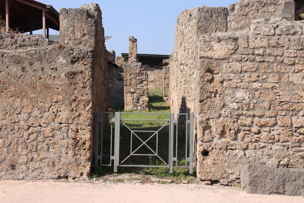 V.3.7 Pompeii. October 2023. Looking north to entrance doorway on Via di Nola. Photo courtesy of Klaus Heese.