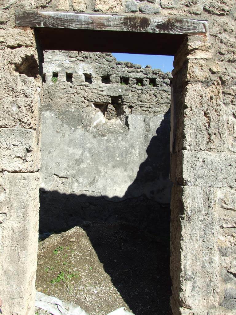 V.3.8 Pompeii. March 2009. Room on east side of atrium. Doorway looking to east wall.