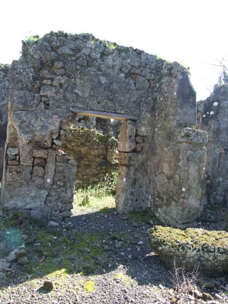 V.3.11 Pompeii. March 2009. Doorway to kitchen, storeroom and latrine. In 1902, the kitchen and latrine were not yet fully excavated.
