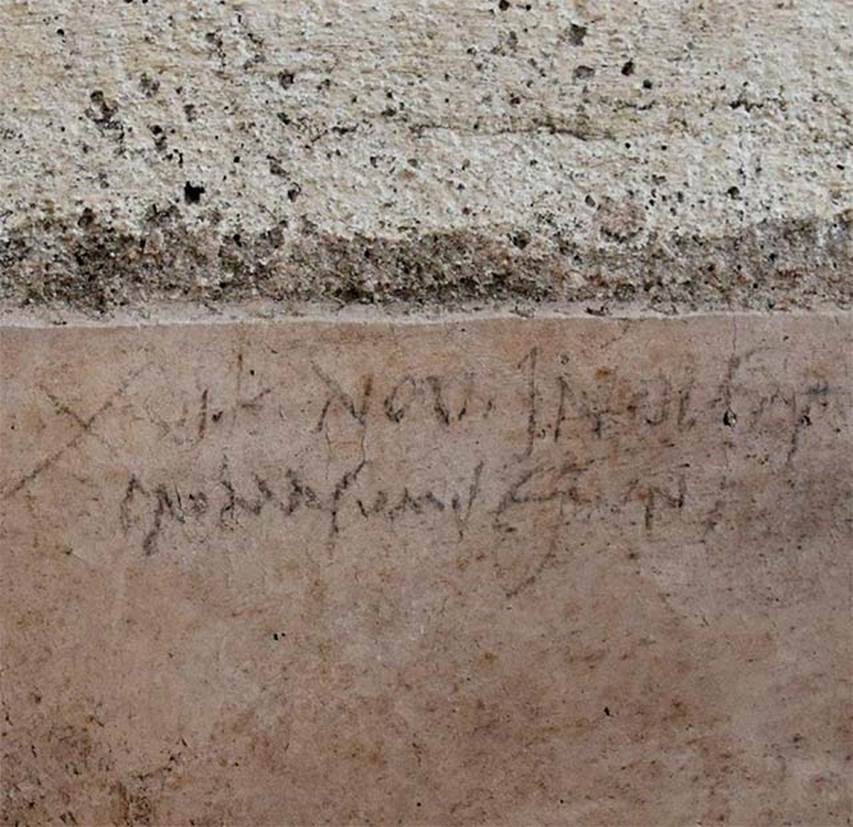 V.3 Pompeii. Casa del Giardino. October 2018.
An inscription written with charcoal, may revolutionize the history of Pompeii, finally allowing to date with greater certainty the eruption of 79 A.D., located so far in August.
Found, during the recent excavation of the "Casa con Giardino" in Regio V, on the wall of a room that, at the time of the eruption, was undergoing renovation, while the rest of the rooms had already been completed; works must therefore have been ongoing at the time of the eruption. The writing is dated to the sixteenth day before the Calends of November, corresponding to the 17th October.
The inscription reads: XVI (ante) K (aleNDAs) Nov (embres) in [d] ulsit pro Masumis Esurit [ions]
-"on October 17 indulged in food in an unrestrained way."
Since the material used to write on the wall could hardly have lasted for a long time, it is probable that the inscription was made in October 79 A.D., a week before the great catastrophe which, according to this hypothesis, would have happened on the 24th of that month.

Una labile scritta, fatta con un carboncino, rivoluziona la storia di Pompei, consentendo, finalmente, di datare con maggiore certezza l’eruzione del 79 d.C., collocata finora nel mese di Agosto.
Rinvenuta, durante il recente scavo della "casa con giardino" nella Regio V, sulla parete di una stanza che, al tempo dell’eruzione, era in corso di ristrutturazione, mentre il resto delle stanze era già stato completato; i lavori devono quindi essere stati in corso al momento dell'eruzione.
L’iscrizione recita: XVI (ante) K(alendas) Nov(embres) in[d]ulsit pro masumis esurit[ioni] 
- “Il 17 ottobre lui indulse al cibo in modo smodato”.
Poiché il materiale utilizzato per scrivere sul muro difficilmente avrebbe potuto resistere a lungo, è probabile che la scritta sia stata realizzata proprio nell’Ottobre del 79 d.C., una settimana prima della grande catastrofe che, secondo questa ipotesi, sarebbe avvenuta il 24 di quel mese.

Photograph © Parco Archeologico di Pompei.
