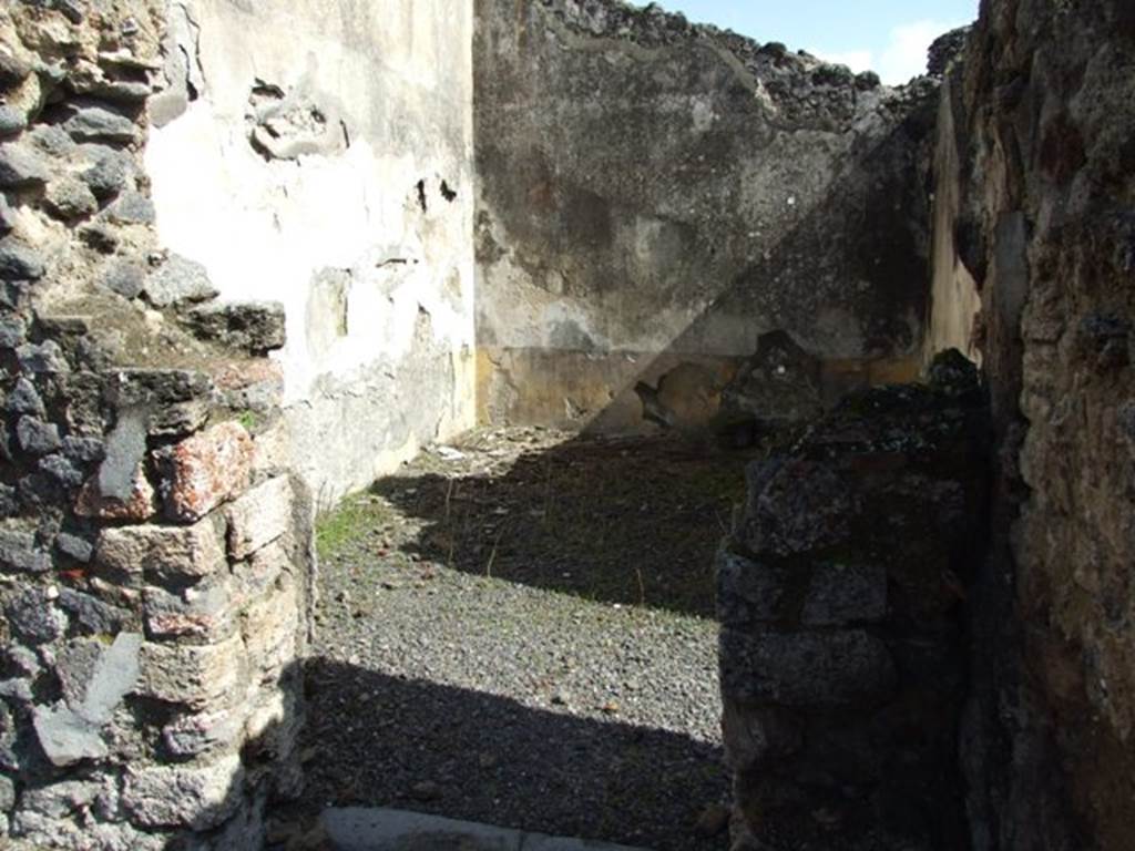 V.4.3 Pompeii. March 2009.  Doorway to triclinium on east side of atrium, with small room or cupboard. Looking east. According to Boyce, items were found among the ruins of two cupboards in the room to the east of the atrium. Together with a hoard of 130 silver and 54 bronze coins, also found were three bronze statuettes of the household gods. The Genius, and two Lares each holding cornucopia and patera and standing solidly on two feet. A marble statuette of Venus Anadyomene and a small marble altar may also have belonged to the shrine. He quoted Notizie degli Scavi di Antichit, 1899, 206. See Boyce G. K., 1937. Corpus of the Lararia of Pompeii. Rome: MAAR 14. (p.40, no.118, note 1). See Giacobello, F., 2008. Larari Pompeiani: Iconografia e culto dei Lari in ambito domestico.  Milano: LED Edizioni. (p.240). According to Sogliano, these were found in the room that opens on the east side of the atrium on 9th May 1899. They are listed in Notizie degli Scavi, 1899, (pages 203-208).