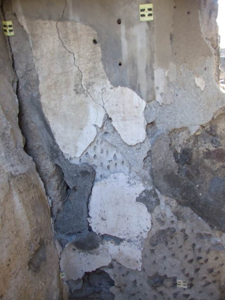 V.4.3 Pompeii.  March 2009. Small cupboard. South east corner and south wall.