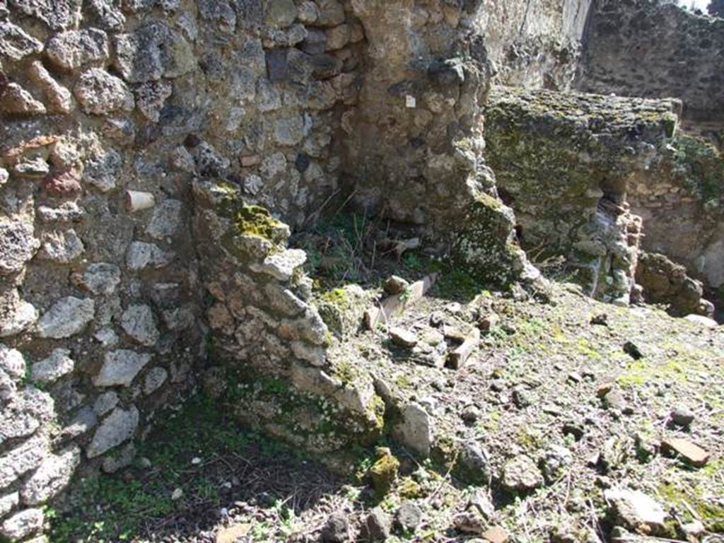 V.4.9 Pompeii. March 2009. Looking south-east towards site of latrine. According to Boyce, in the small room to the left of the entrance, on the south wall near the latrine, was a painting of Fortuna. This is no longer visible. 
See Boyce G. K., 1937. Corpus of the Lararia of Pompeii. Rome: MAAR 14. (p.41, no.122) 

