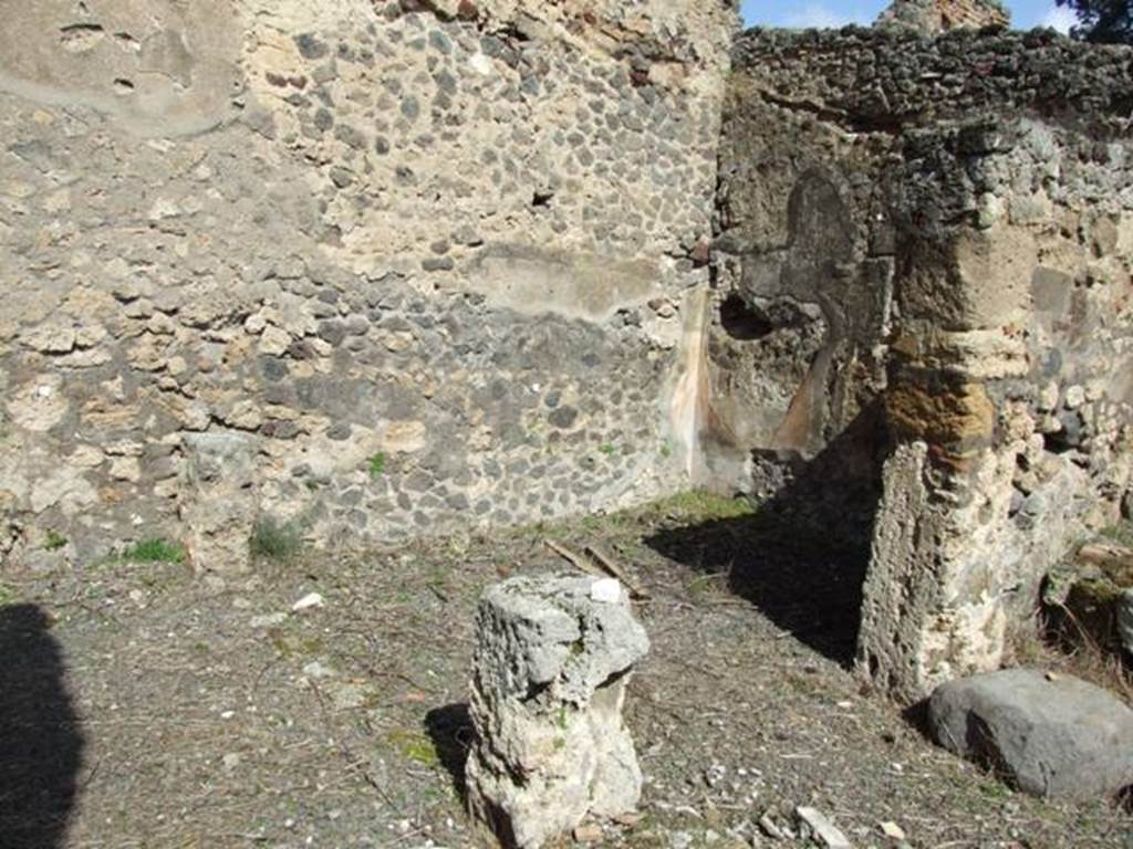 V.4.9 Pompeii. March 2009. Looking north-east towards room on north side of atrium, with remains of west wall behind pillar.