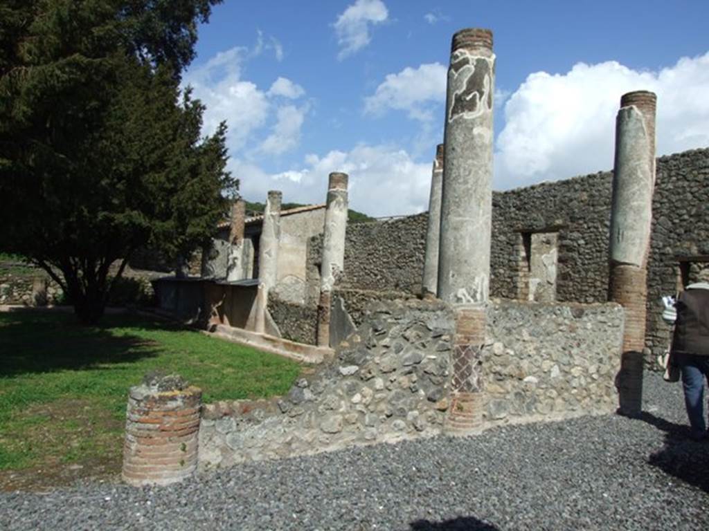 V.5.3 Pompeii. March 2009. Room 7, south-east corner of peristyle. 
According to Della Corte, 143 inscriptions (CIL IV 4280-4423) were found in this house and peristyle. See Della Corte, M., 1965.  Case ed Abitanti di Pompei. Napoli: Fausto Fiorentino. (p.139-41)
In BdI, 1890, various inscriptions of the gladiators are listed, including which column they were found on. The columns in the photo above, would have been numbered 6 (broken one on left), 7 and 8, along the south side. Number 9 would have been the first column on the east side, after number 8 in the south-east corner. See BdI, 1890, p. 25-39.
