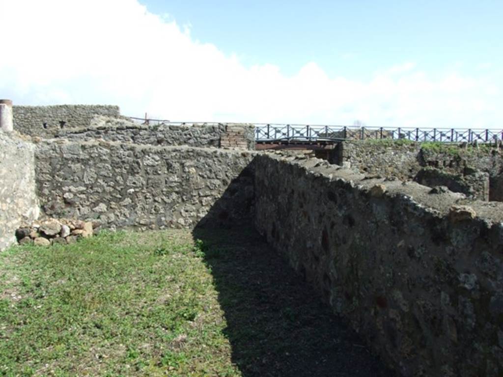 V.5.3 Pompeii. March 2009. Room 11, looking south-east across triclinium, towards bridge over Via di Nola.