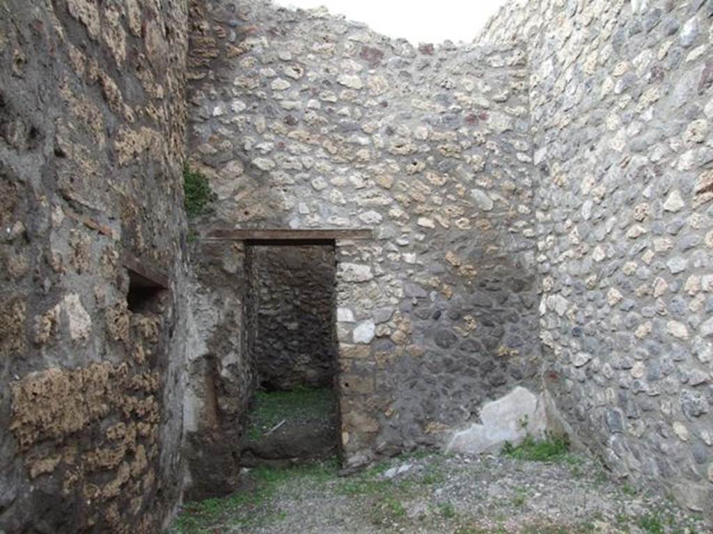 V.5.4 Pompeii. March 2009. North wall, with door to rear room.