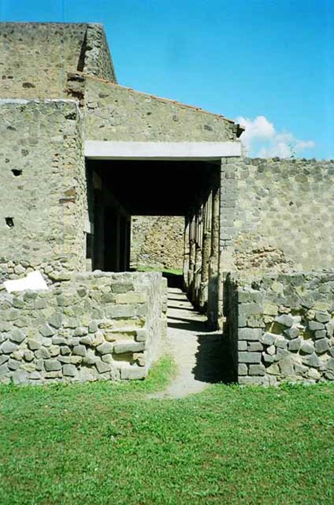 VI.2.4 Pompeii. June 2010. Looking north along garden portico, from near remains of kitchen, on left.  Photo courtesy of Rick Bauer.