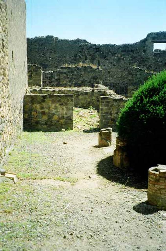 VI.2.4 Pompeii. June 2010. Looking east along portico towards kitchen. Photo courtesy of Rick Bauer.
