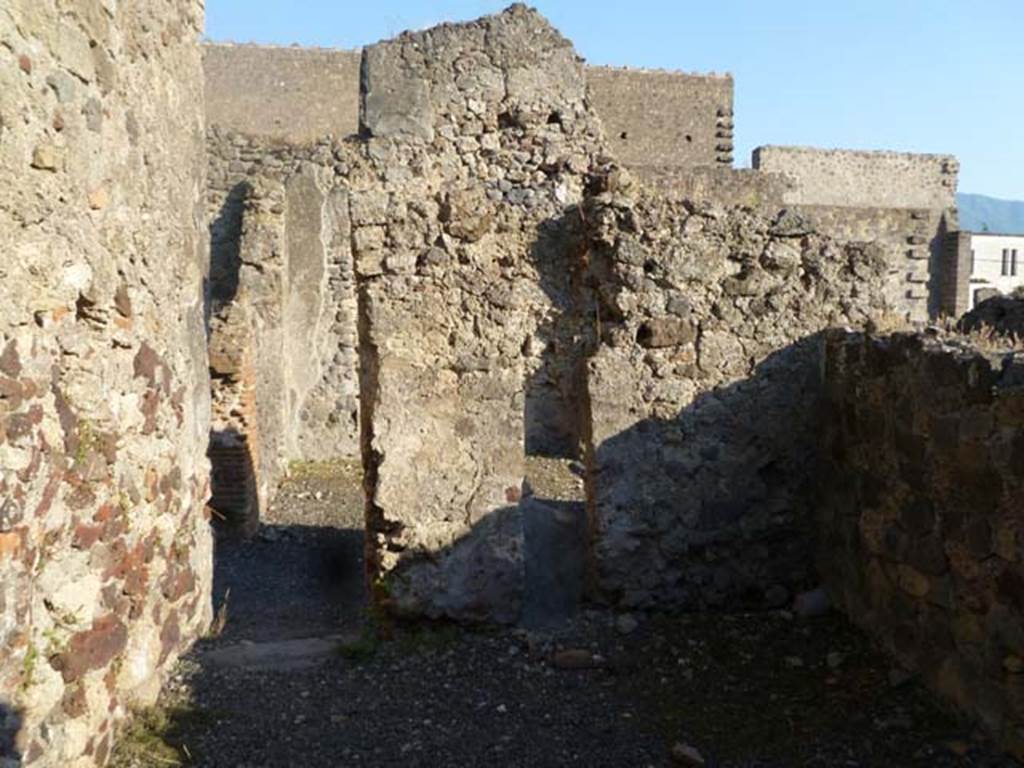 VI.2.7 Pompeii. May 2011. Looking south towards doorway of room on north side of corridor.  Photo courtesy of Michael Binns.
