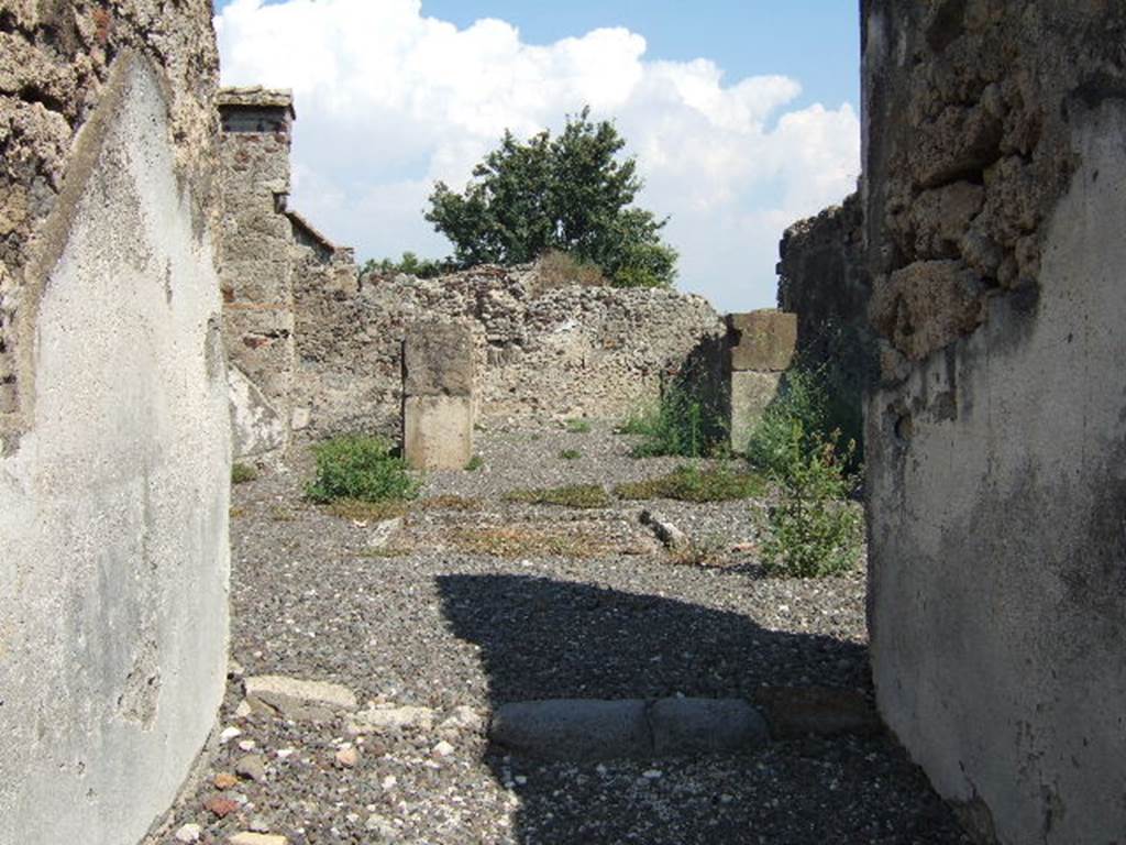 VI.2.12 Pompeii. September 2005. Room 1. Looking east through fauces and across atrium to tablinum.