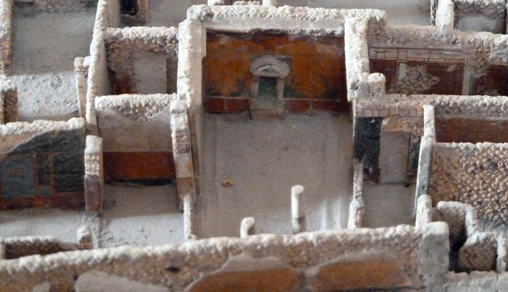 VI.2.15 Pompeii. May 2010. Looking south towards Lararium on south wall of peristyle. Model as viewed in Naples Archaeological Museum.
