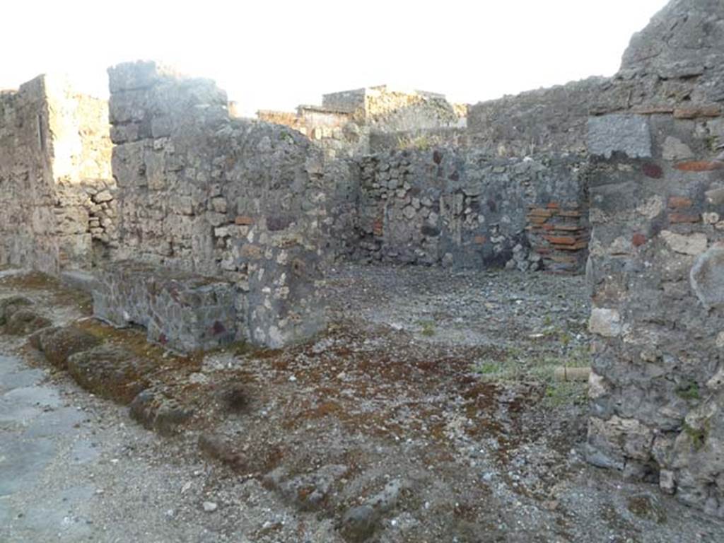 VI.2.23 Pompeii. May 2011. Looking south-west through entrance doorway. On the left is the bench outside of wall between VI.2.23 and VI.2.24.