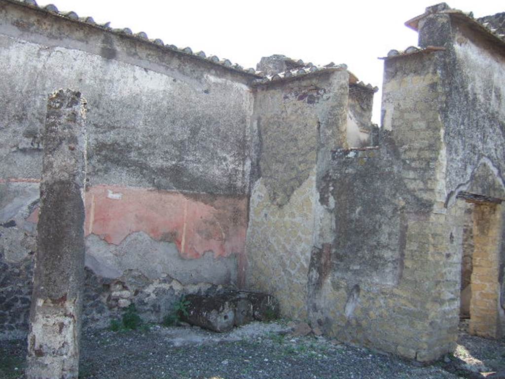 VI.2.25 Pompeii. September 2005. South side of peristyle garden, with doorway on right to cubiculum. According to Jashemski, the peristyle garden was the heart of the house, enclosed on all four sides by a portico.
The portico was supported by eight columns. See Jashemski, W. F., 1993. The Gardens of Pompeii, Volume II: Appendices. New York: Caratzas. (p.123)
