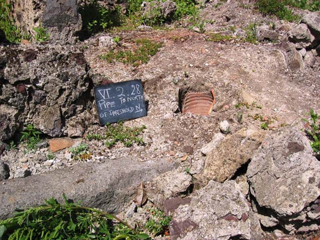 VI.2.28 Pompeii. July 2008. Remains of pipe, near thrshold. Photo courtesy of Barry Hobson.