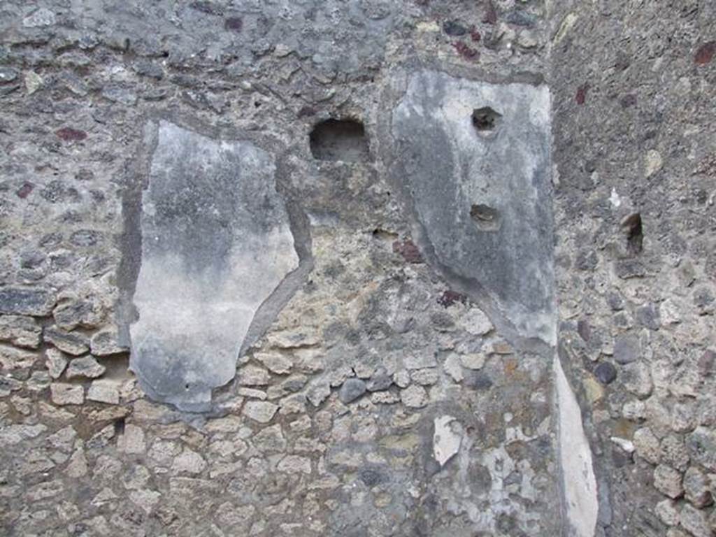 VI.3.3 Pompeii. March 2009. Room 6, south wall of kneading room with holes for shelving supports.