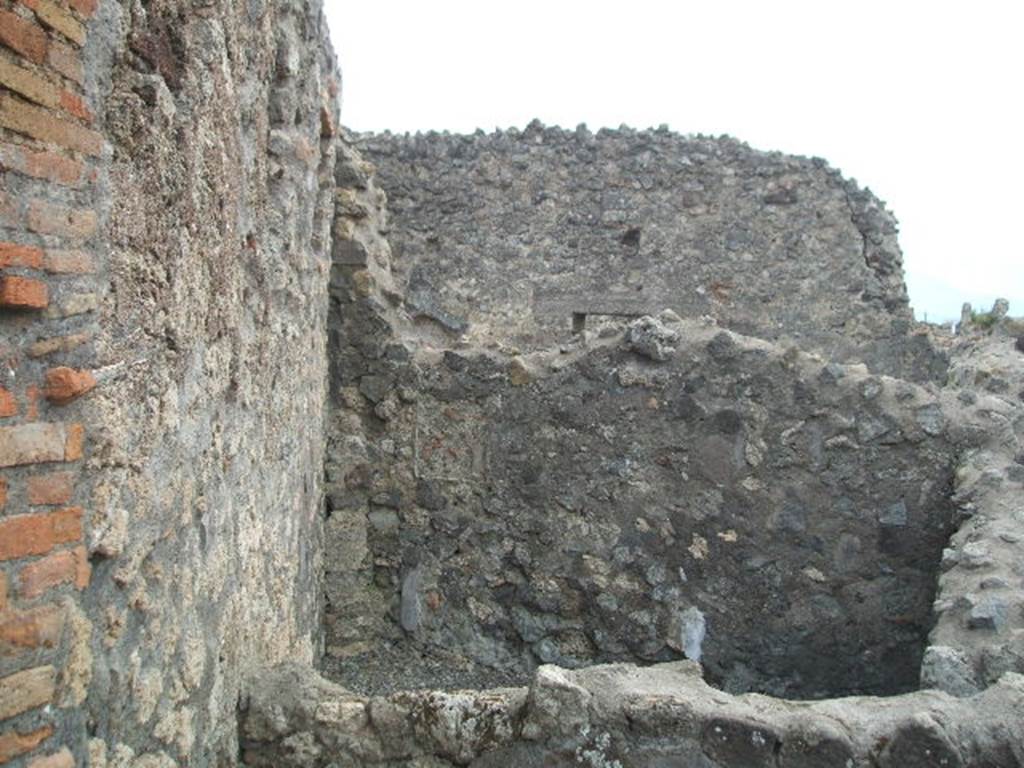 VI.4.2 Pompeii. May 2005. Looking south from entrance towards rear room, possibly a cubiculum of VI.4.1.

