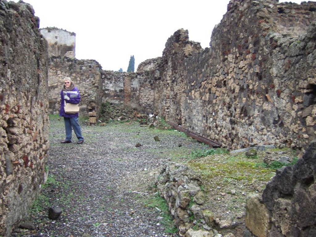 VI.4.10 Pompeii.  December 2005.  Looking north across atrium.  The site of  a room with the remains of a staircase can be seen on the east side of the entrance fauces

