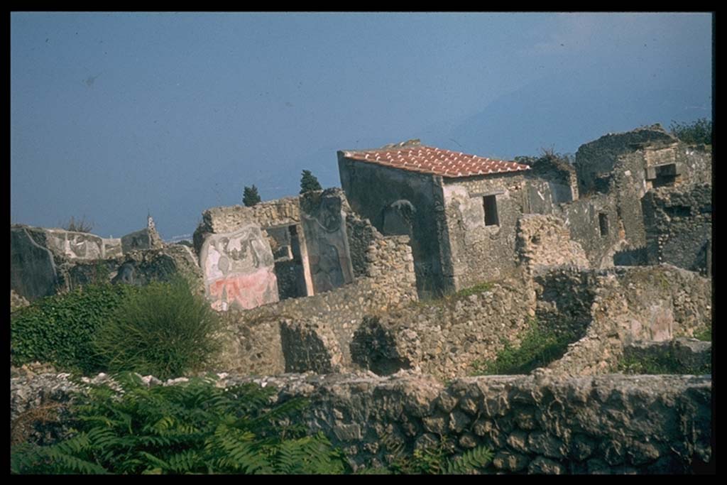 VI.5.3 Pompeii. Looking south-east from the walls, across corner of VI.2, to road and entrance doorway of VI.5.3.
Photographed 1970-79 by Günther Einhorn, picture courtesy of his son Ralf Einhorn.
