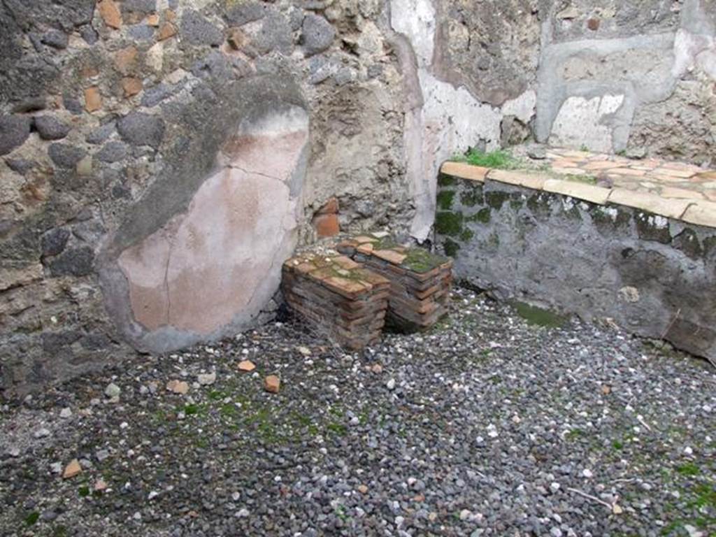 VI.5.4 Pompeii. December 2007. Room 1, looking north-west in kitchen towards latrine and hearth.