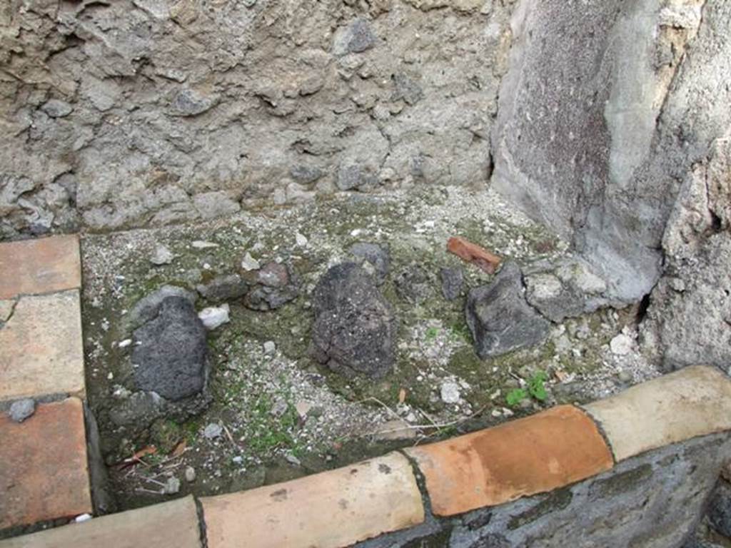 VI.5.4 Pompeii. December 2007. Room 1, north-east corner of kitchen hearth.