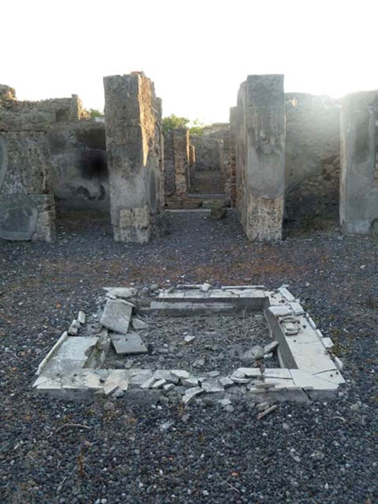 VI.5.8 Pompeii. May 2011. Looking west across impluvium in atrium, towards entrance corridor.