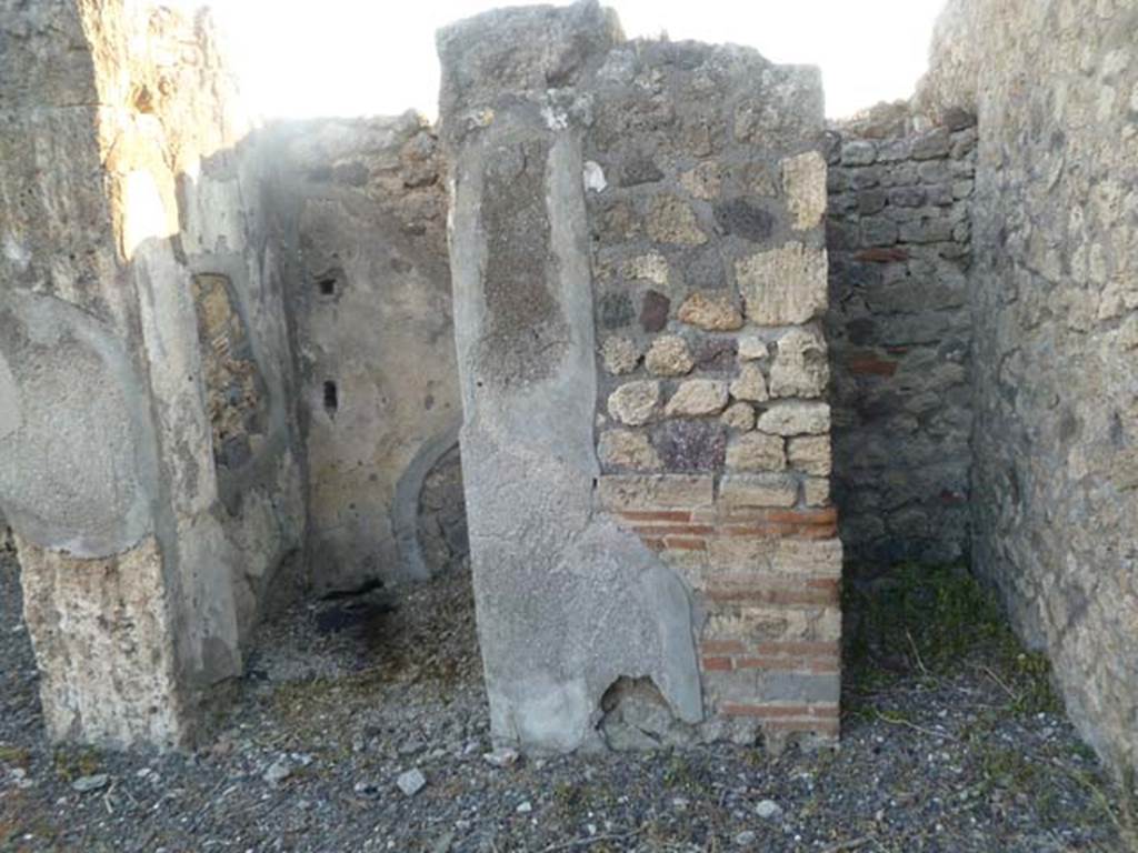 VI.5.8 Pompeii, May 2011. Doorways to rooms in north-west corner of atrium, looking west. 
According to Fiorelli, the doorway on the left was a storeroom or cupboard, with stairs to upper floor.
See Pappalardo, U., 2001. La Descrizione di Pompei per Giuseppe Fiorelli (1875). Napoli: Massa Editore. (p.54)
 