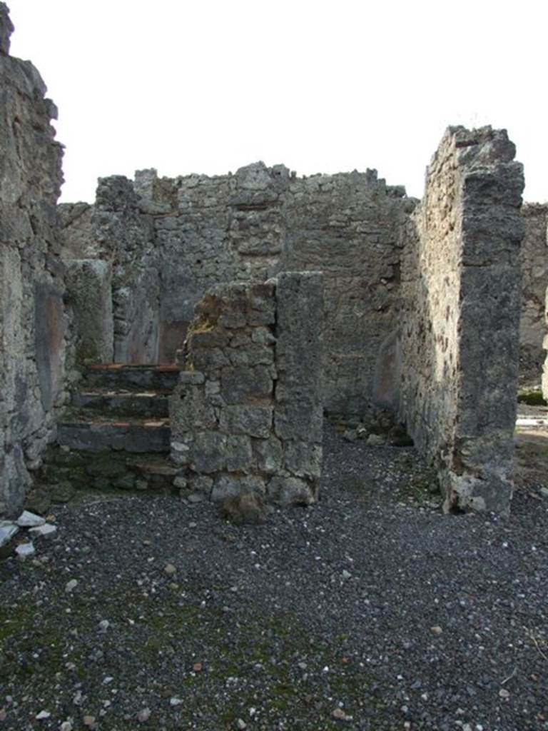 VI.5.9 Pompeii. December 2007. Looking west from south-west corner of atrium, towards stairs to upper floor and doorway to cubiculum.