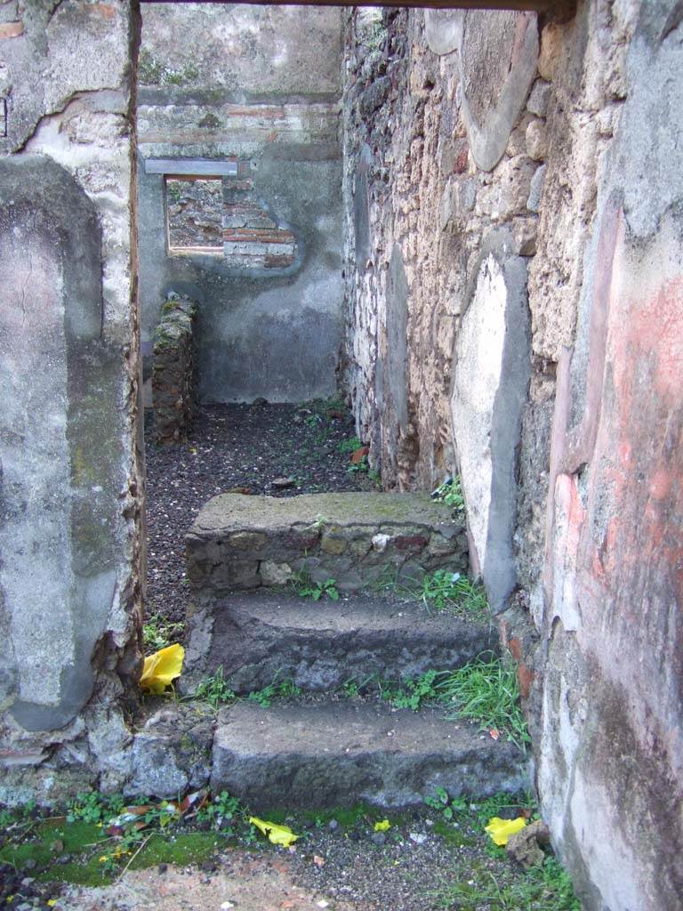 VI.5.16 Pompeii. December 2005. Steps to upper floor on south side of atrium.