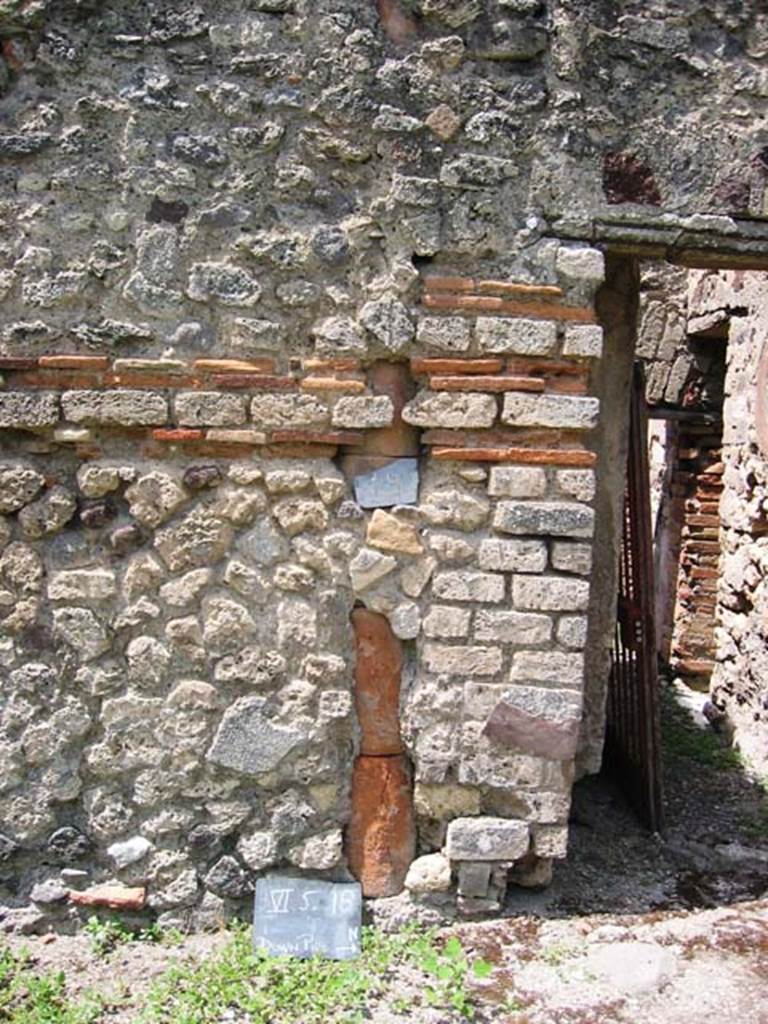 VI.5.18 Pompeii. July 2008. Downpipe on south side of entrance doorway. Photo courtesy of Barry Hobson.
