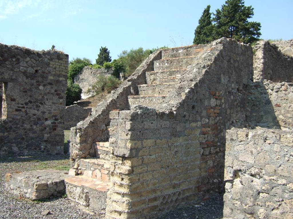 VI.5.22 Pompeii. September 2005. Looking north-west from entrance towards stairs to upper floor.