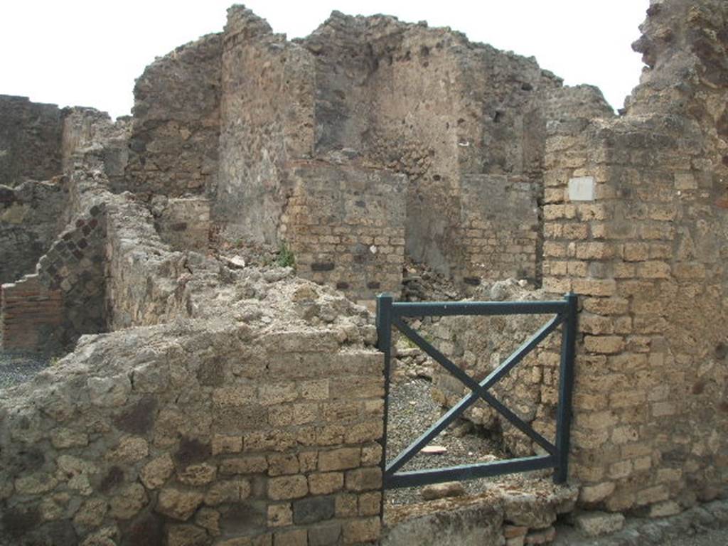 VI.6.6 Pompeii. May 2005. Looking west to entrance that led to the stairs to an independent dwelling on the upper floor. In the night of 14th-15th September 1943, a bomb fell near here destroying three rooms with four dividing walls and the perimeter wall, part of VI.6.7. See Garcia y Garcia, L., 2006. Danni di guerra a Pompei. Rome: LErma di Bretschneider. (p.76)
