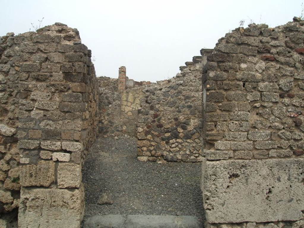 VI.6.14 Pompeii. May 2005. Looking east through entrance doorway, and towards doorway in east wall to rear room.