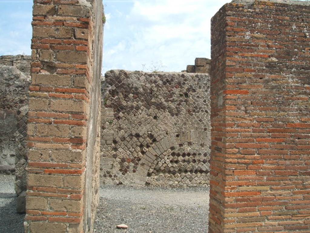 VI.6.19 Pompeii. May 2005. Looking west towards entrance doorway, in centre.  According to Della Corte, CIL IV 138, was found above one of the external pilasters in the south-west corner of insula VI.6.
See Della Corte, M., 1965.  Case ed Abitanti di Pompei. Napoli: Fausto Fiorentino. (p.113)  Fiorelli would appear to agree with Della Corte, as he said the advertisement was found on the walls of VI.6.18/19.
See Pappalardo, U., 2001. La Descrizione di Pompei per Giuseppe Fiorelli (1875). Napoli: Massa Editore. (p.56)
According to Mau, this public advertisement of a building to rent had now faded and vanished. The insula named after Arrius Pollio was thought by Fiorelli to be the so-called House of Pansa, across the street from the block on which the advertisement was found.  The identification may be correct  but a notice painted in so prominent a place might refer to a block in any part of the city. Maus translation was -
To rent from the first day of next July, shops with the floors over them, fine upper chambers, and a house in the Arrius Pollio block owned by Gnaeus Alleius Nigidius Maius.  Prospective lessees may apply to Primus, slave of Gnaeus Alleius Nigidius Maius.
See Mau, A., 1907, translated by Kelsey, F. W., Pompeii: Its Life and Art. New York: Macmillan. (p. 489).
According to Epigraphik-Datenbank Clauss/Slaby (See www.manfredclauss.de), it read as -
Insula Arriana 
Polliana Gn(aei!) Al<le=IF>i Nigidi Mai 
locantur ex <K=I>(alendis) Iuli(i)s primis tanernae 
cum pergulis suis et c{o}enacula 
equestria et domus conductor(is) 
convenito Primum Gn(aei) Al<le=IF>i 
Nigidi Mai ser(vum)      [CIL IV 138]

