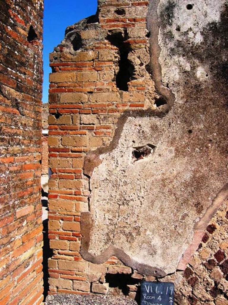 VI.6.19 Pompeii. July 2008. Downpipe in north wall near entrance doorway. Photo courtesy of Barry Hobson.