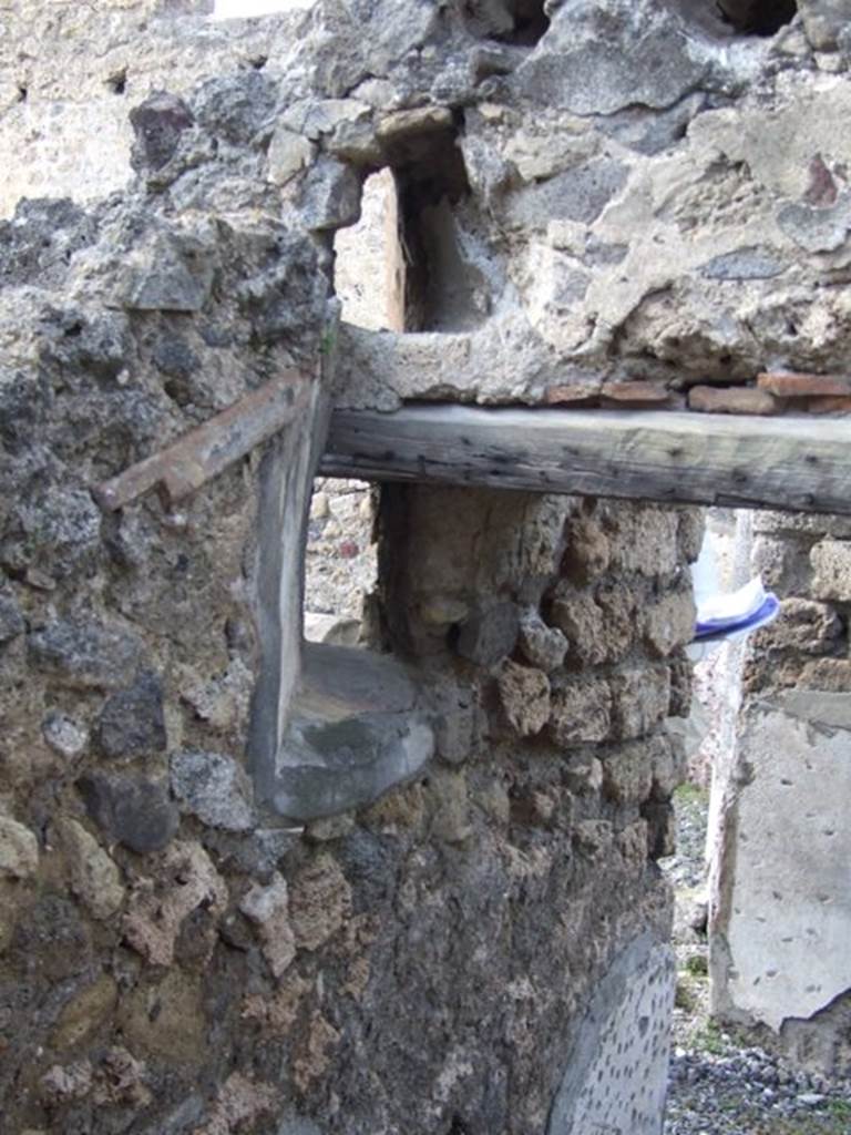 VI.7.1 Pompeii. March 2009. West side of door to small room or storeroom with remains of two vents.


