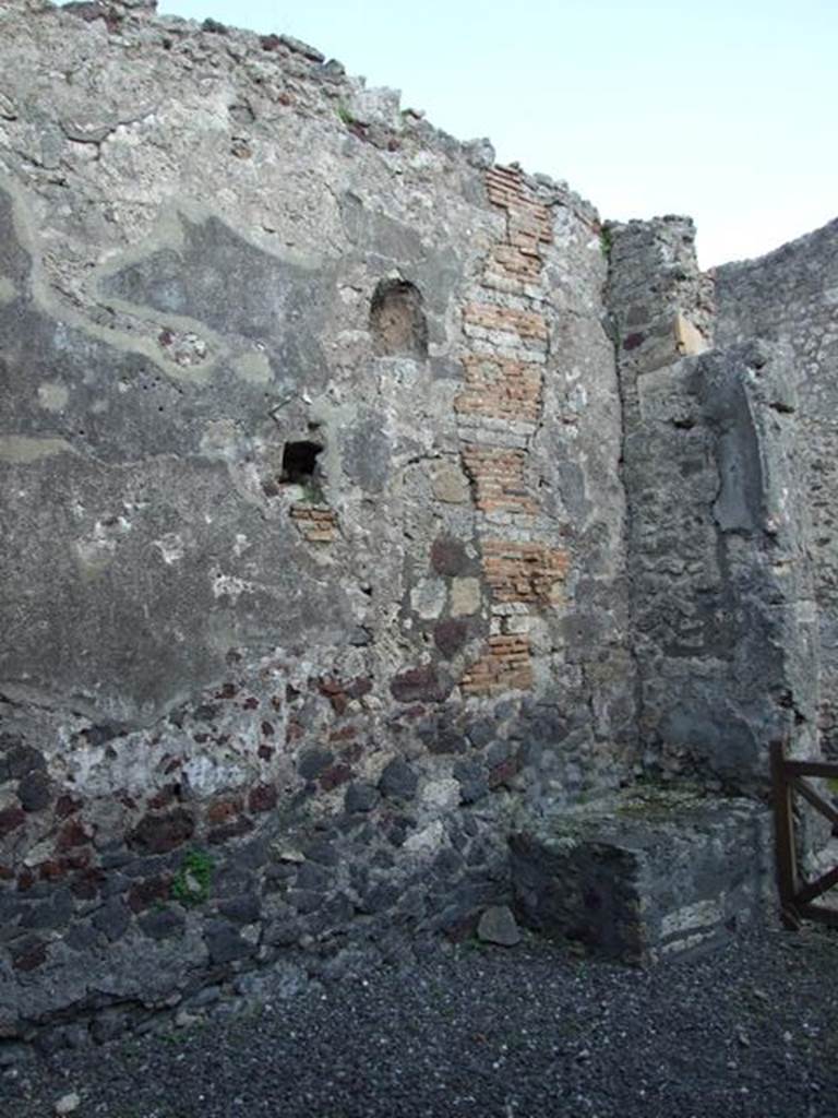 VI.7.5 Pompeii.  March 2009.  East wall, looking south east at niche and hearth. 