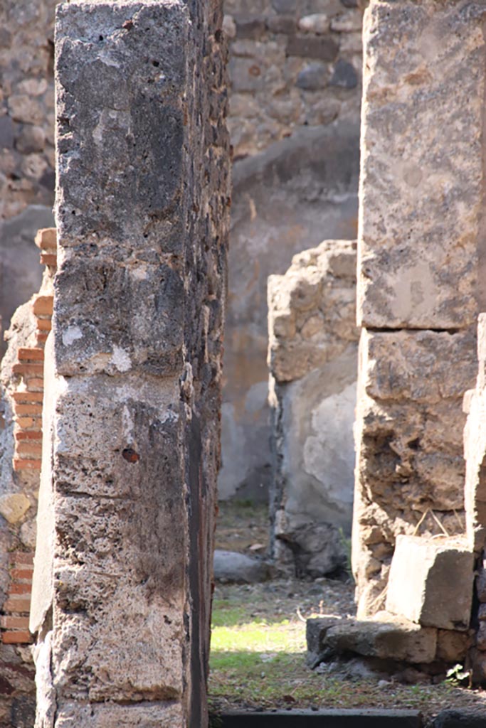 VI.7.16 Pompeii. October 2022. 
Looking west along corridor to rear in north-west corner of atrium. Photo courtesy of Klaus Heese.
