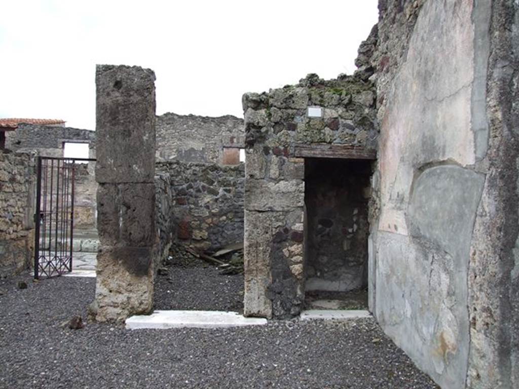 VI.7.20 Pompeii. December 2006. Doorways to rooms in south-east corner of atrium.