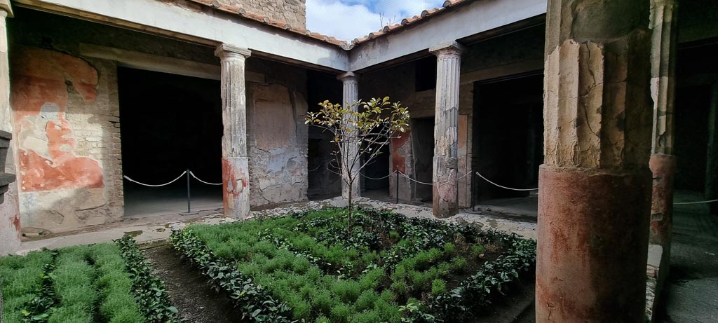 VI.8.3 Pompeii. December 2023. Looking east across peristyle, with doorway to room 12, on left. Photo courtesy of Miriam Colomer.