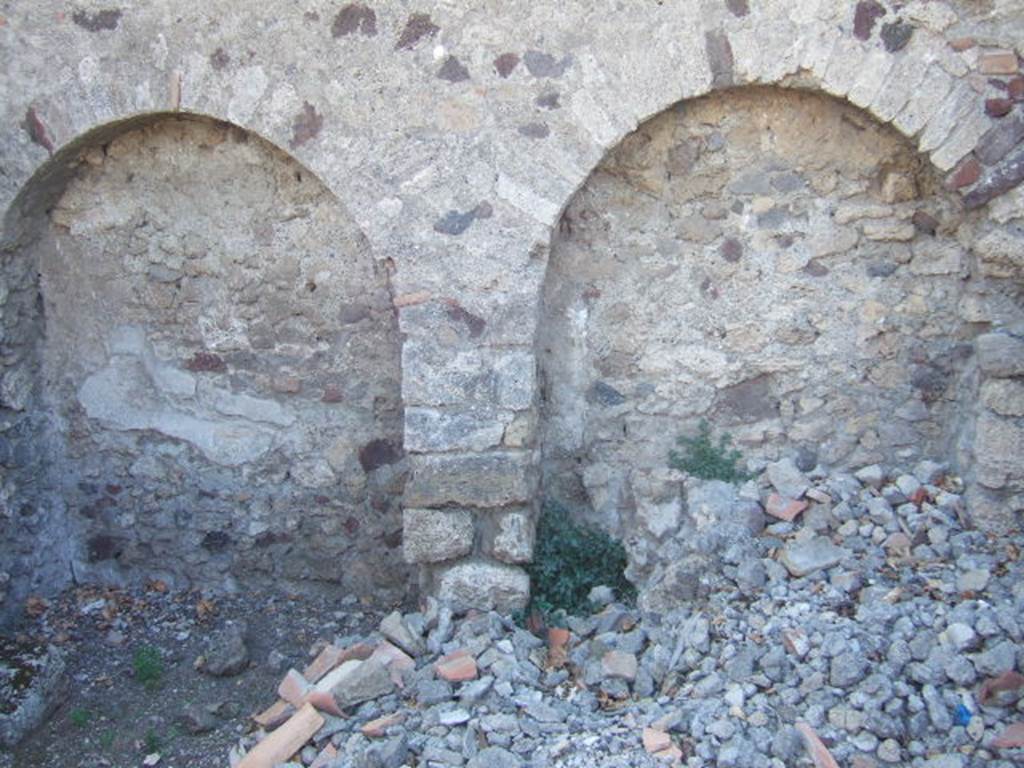 VI.9.2 Pompeii. September 2004. Room 38, west wall of kitchen. The lararium painting was found in an area marked u on a plan by Overbeck. This would coincide with the arched area on the right.
