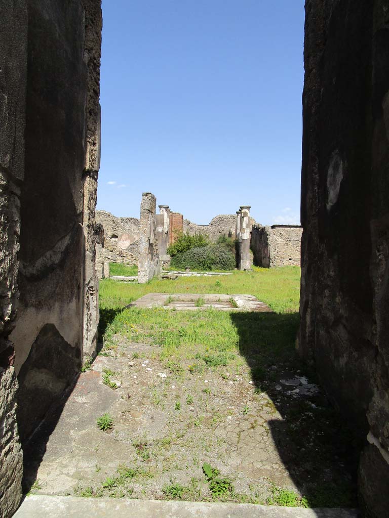 VI.9.3 Pompeii. April 2019. Looking east from entrance doorway. Photo courtesy of Rick Bauer.
According to Niccolini –
“No.3. The following are two houses communicating with each other, lived in perhaps by the same people. 
The entrance corridor of the first house was preceded by a vestibule and leaning against it to the left was an oecus, and to the right by a cubiculum containing a small cupboard/closet. In the right-hand wall of the tuscanic atrium we could see two doorways, of which one was bricked up and the other led into the following dwelling. 
On the left-hand side we found three cupboards/small storerooms, a repository and the masonry block used to support the domestic strong-box, near to where thirteen silver spoons were found.
At the rear of the atrium was the tablinum with an oecus on its left and a corridor on its right, leading to the garden area surrounded on two sides by columns joined between them by a masonry podium, in which was built a channel for the cultivation of flowers
To the left of the portico was a cubiculum, the stairs to the upper floor, the store-room and the kitchen, which also had a secondary rear doorway (at VI.9.12) on the eastern roadway.
On the east side was a triclinium, an exedra decorated with a painting of Venus and Aeneas, (see Helbig 1382), and finally a ruined room.”
See Niccolini, vol.2, 1862, p.35
