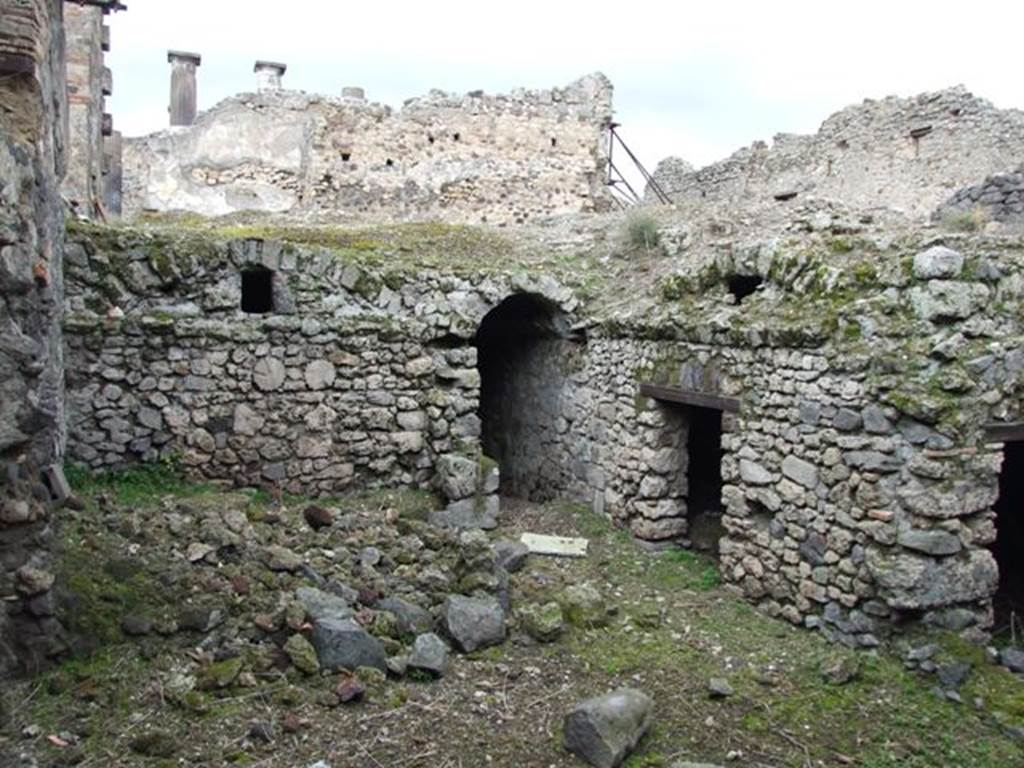 VI.9.10 Pompeii.  March 2009.  Kitchen area underneath rear of house.   Note the columns used in building the wall.