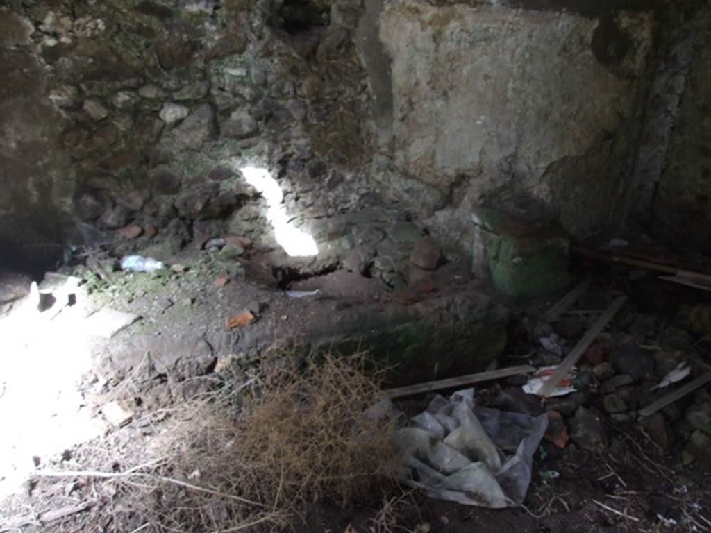 VI.9.10 Pompeii. March 2009. North wall of kitchen, with hearth and altar.