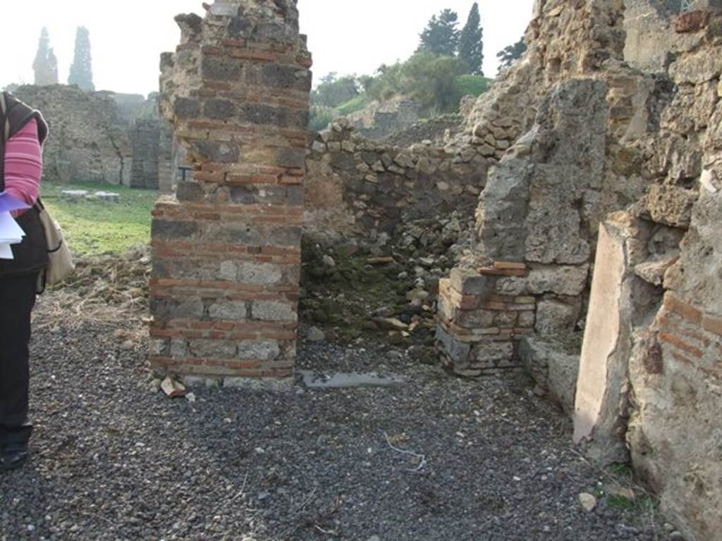 VI.9.14 Pompeii. December 2007. Looking west into doorway to room 32, from north-west corner of room 22, the secondary atrium. Room 32 was a cubiculum on west side of atrium, on the north side of the corridor/tablinum. According to Packer in the north-west corner of the atrium, the wall decoration consisted of red and green borders separating a white main zone from a low white dado.
See Cronache Pompeiane, IV, 1978, for article by Packer, J: Inns at Pompeii: a short survey (p.24-30)
See Bullettino Archeologico Napolitano, 1, 1843, p.68-70.


